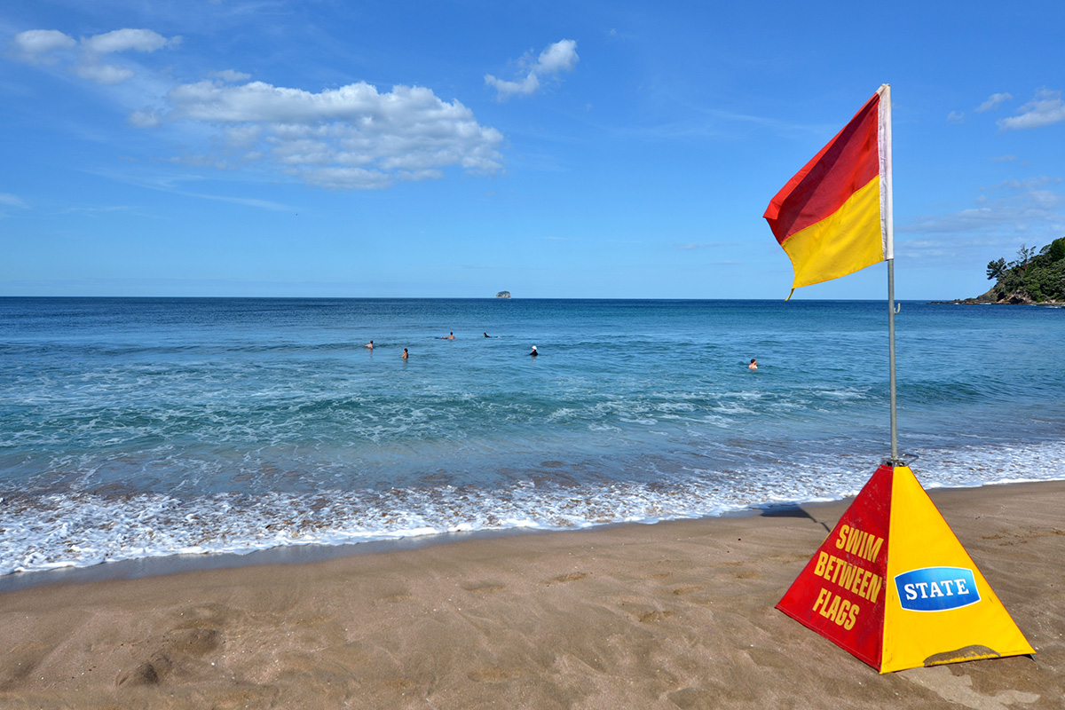 Beach with a surf lifesaving sign