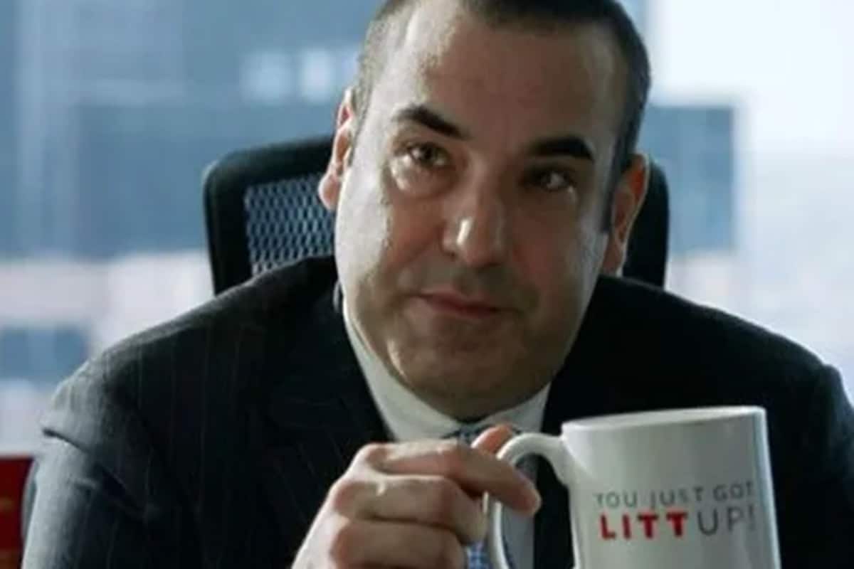 Louis Litt holding mug